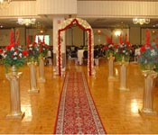 GOLDEN AISLE PILLARS WITH WELCOME LIGHTED GATE